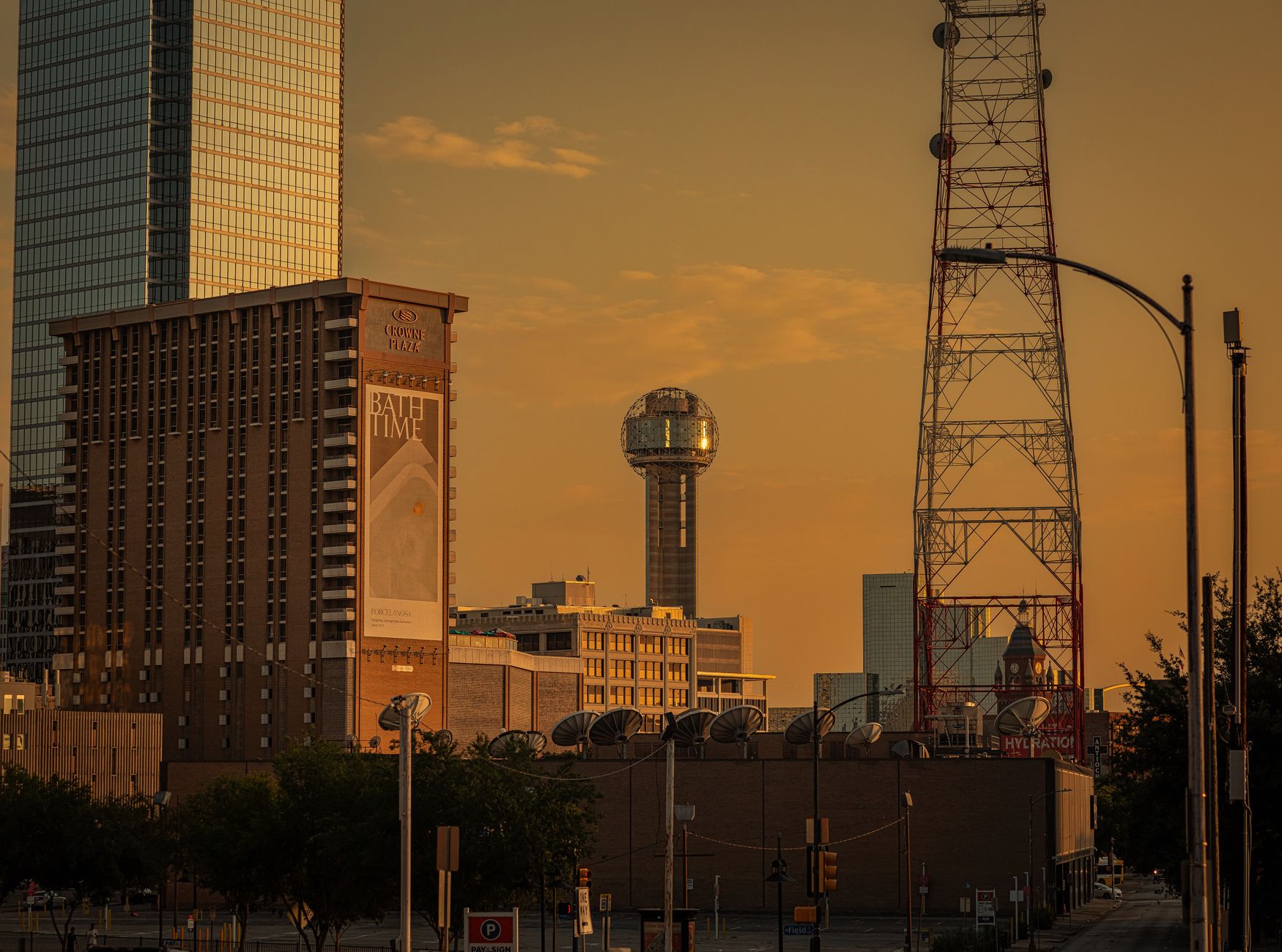 Reunion Tower and the Dallas skyline glowing at sunset