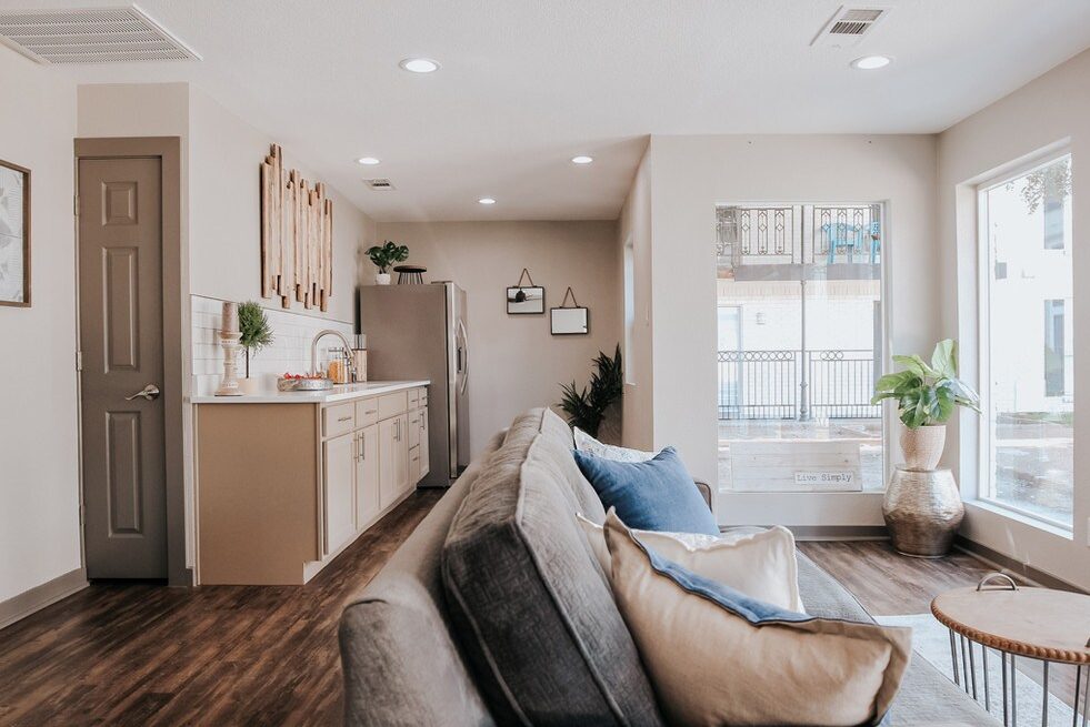Spacious living room with a sectional sofa and natural light